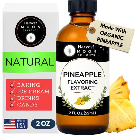Harvest Moon Delights pineapple flavoring extract bottle with packaging and a pineapple on a white background